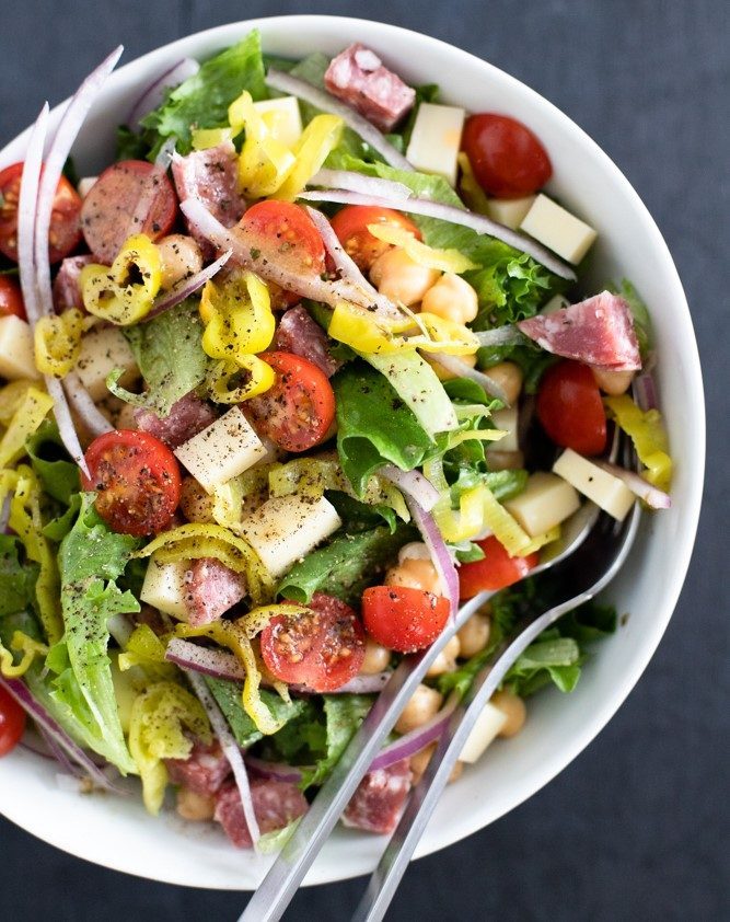 Italian chopped salad in white bowl.